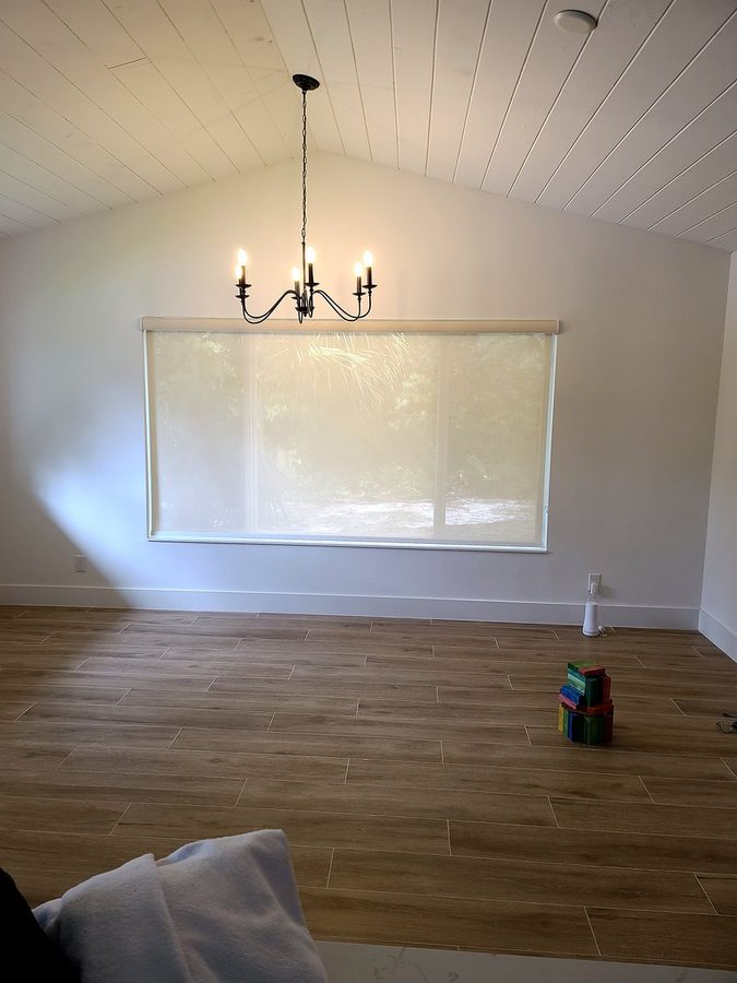 Roller shade oceanfront bedroom