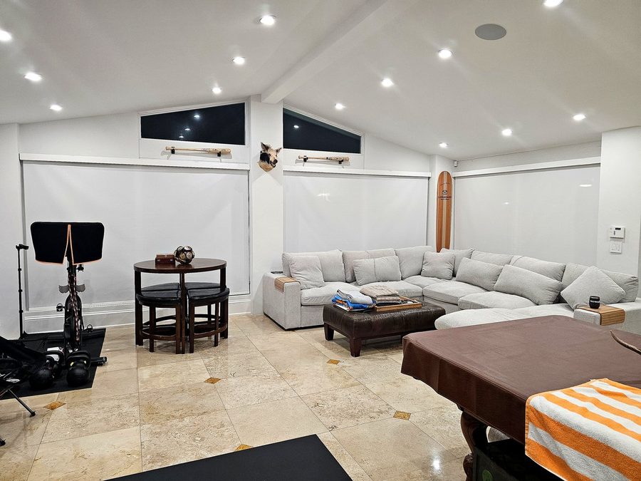 Motorized roller shades game room